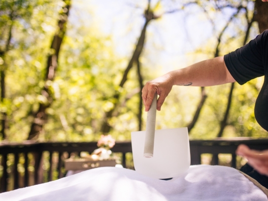 Masseuse using sound at L'Apothecary spa