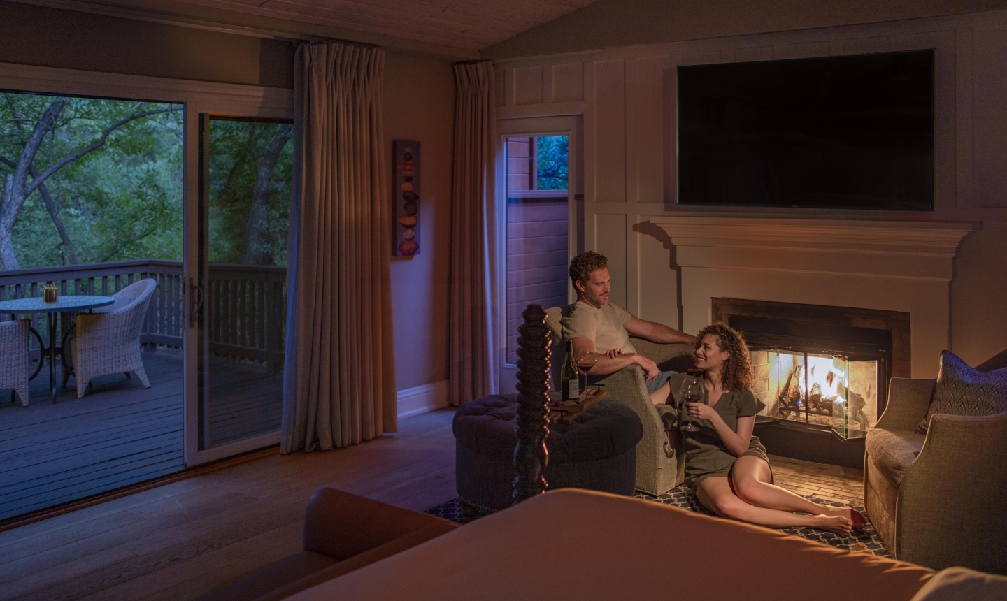 Couple sitting by the fireplace